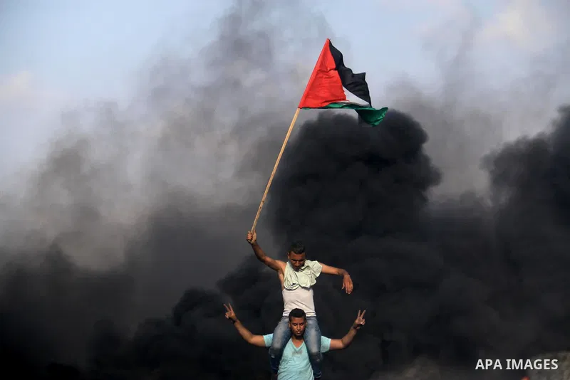 Palestinian protesters clash with Israeli security forces during tents protest demanding the right to return to their homeland, at the Israel-Gaza border, in Bureij in the cetner of Gaza strip on April 27, 2018. Photo by...