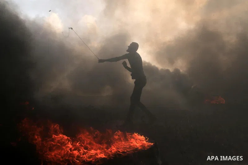 Palestinian protesters clash with Israeli security forces during tents protest demanding the right to return to their homeland, at the Israel-Gaza border, in Bureij in the cetner of Gaza strip on April 27, 2018. Photo by...