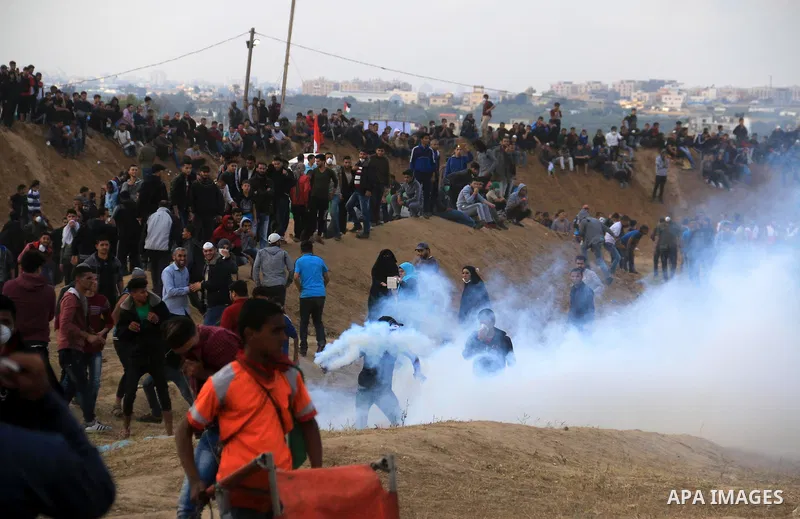 Palestinian protesters clash with Israeli security forces during tents protest demanding the right to return to their homeland, at the Israel-Gaza border, in Bureij in the cetner of Gaza strip on April 27, 2018. Photo by...