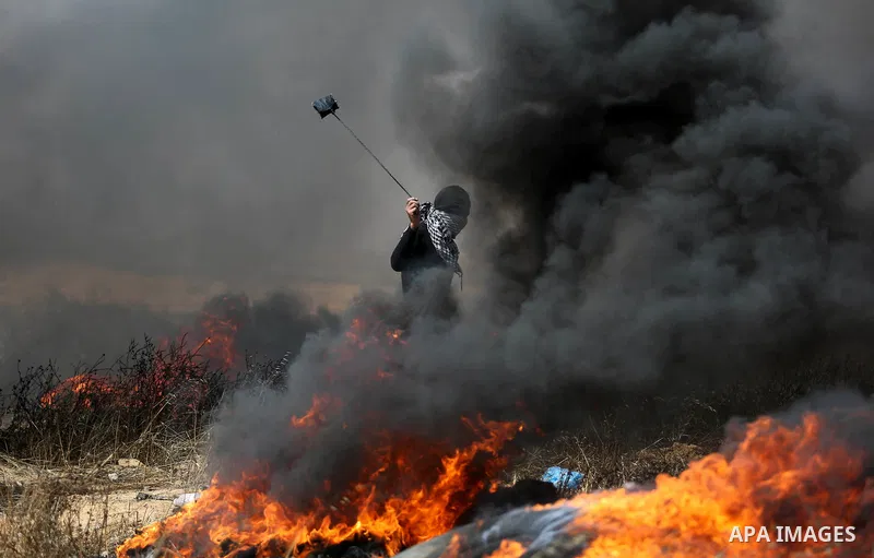 Palestinian protesters clash with Israeli security forces during tents protest demanding the right to return to their homeland, at the Israel-Gaza border, in Khan Younis in the southern Gaza Strip on April 27, 2018. on A...