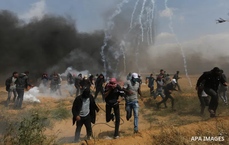 Palestinian protesters clash with Israeli security forces during tents protest demanding the right to return to their homeland, at the Israel-Gaza border, in Khan Younis in the southern Gaza Strip on April 27, 2018. on A...