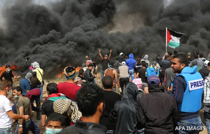 Palestinian protesters clash with Israeli security forces during tents protest demanding the right to return to their homeland, at the Israel-Gaza border, in Khan Younis in the southern Gaza Strip on April 27, 2018. on A...