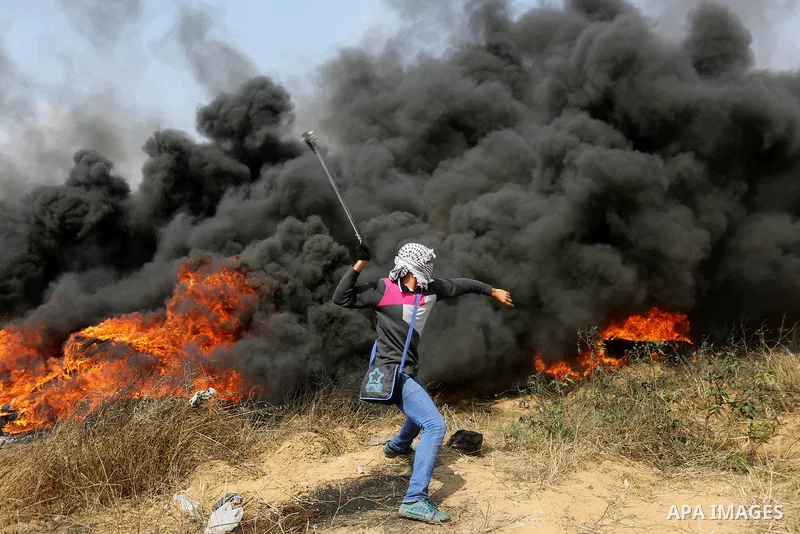 Palestinian protesters clash with Israeli security forces during tents protest demanding the right to return to their homeland, at the Israel-Gaza border, in Khan Younis in the southern Gaza Strip on April 27, 2018. on A...
