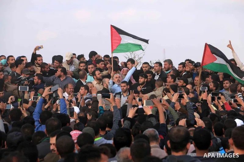 Hamas's leader in the Gaza Strip Yahya Sinwar takes part during a tent city protest along the Israel border with Gaza, demanding the right to return to their homeland, in Khan Younis in the southern Gaza Strip on April 2...