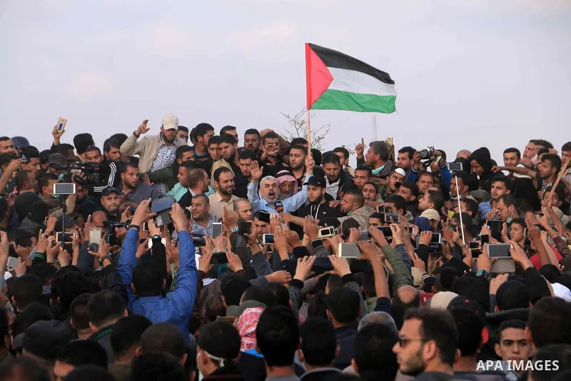 Hamas's leader in the Gaza Strip Yahya Sinwar takes part during a tent city protest along the Israel border with Gaza, demanding the right to return to their homeland, in Khan Younis in the southern Gaza Strip on April 2...