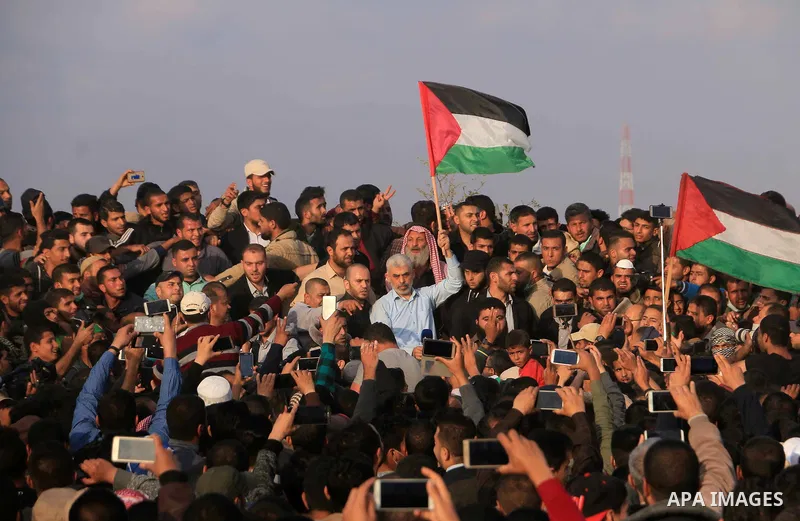 Hamas's leader in the Gaza Strip Yahya Sinwar takes part during a tent city protest along the Israel border with Gaza, demanding the right to return to their homeland, in Khan Younis in the southern Gaza Strip on April 2...