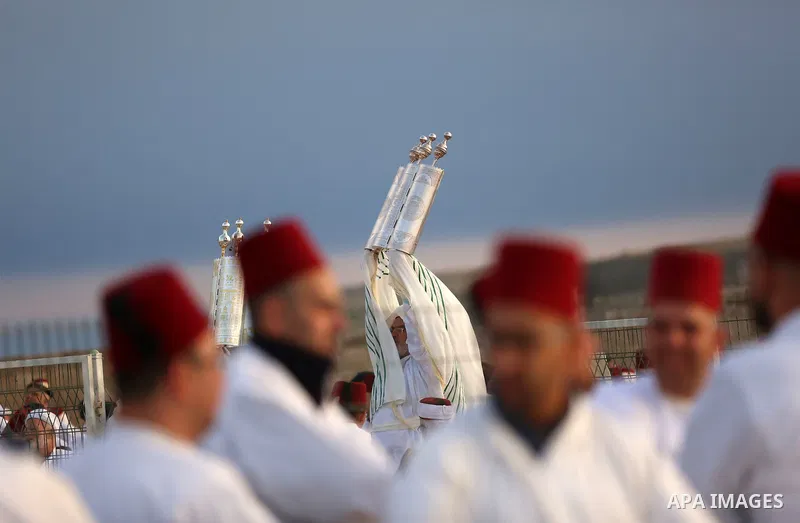 Members of the ancient Samaritan community take part in a traditional pilgrimage marking the holiday of Passover, on Mount Gerizim near the West Bank city of Nablus, on May 6, 2018. Photo by Shadi Jarar'ah