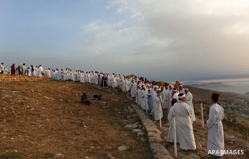 Members of the ancient Samaritan community take part in a traditional pilgrimage marking the holiday of Passover, on Mount Gerizim near the West Bank city of Nablus, on May 6, 2018. Photo by Shadi Jarar'ah