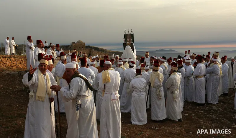 Members of the ancient Samaritan community take part in a traditional pilgrimage marking the holiday of Passover, on Mount Gerizim near the West Bank city of Nablus, on May 6, 2018. Photo by Shadi Jarar'ah