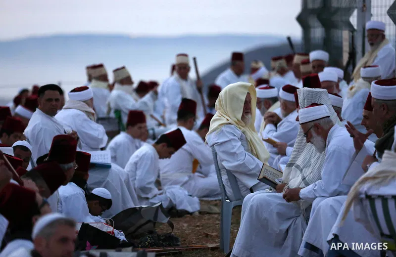 Members of the ancient Samaritan community take part in a traditional pilgrimage marking the holiday of Passover, on Mount Gerizim near the West Bank city of Nablus, on May 6, 2018. Photo by Shadi Jarar'ah