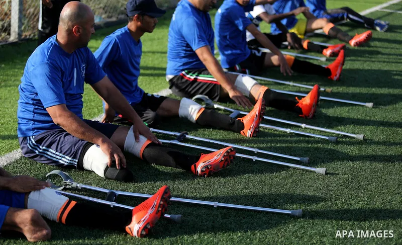 Disabled Palestinians who were lost their limbs during the Israeli wars on Gaza Strip participate in football training, in Deir al-Balah in the center of Gaza Strip on May 7, 2018. Photo by Ashraf Amra