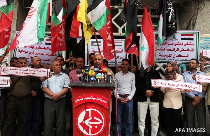Palestinian supporters of Popular Front for the Liberation of Palestine (PFLP) take part during a rally to support people in Syria in Gaza city on May 10, 2018. Photo by Mahmoud Ajour