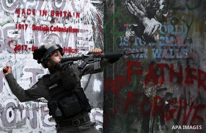 Israeli security forces take position during clashes with Palestinian protesters following a protest against U.S. embassy move to Jerusalem and on the occasion of the 70th anniversary of the "Nakba" in Bethlehem in the o...