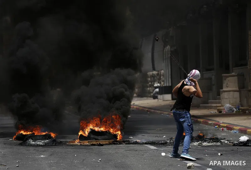 Palestinian protesters clash with Israeli security forces following a protest against U.S. embassy move to Jerusalem and on the occasion of the 70th anniversary of the "Nakba" in Bethlehem in the occupied West Bank May 1...