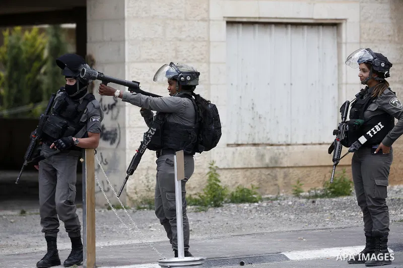 Israeli security forces take position during clashes with Palestinian protesters following a protest against U.S. embassy move to Jerusalem and on the occasion of the 70th anniversary of the "Nakba" in Bethlehem in the o...