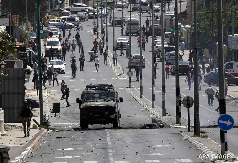 Israeli security forces take position during clashes with Palestinian protesters following a protest against U.S. embassy move to Jerusalem and on the occasion of the 70th anniversary of the "Nakba" in Bethlehem in the o...