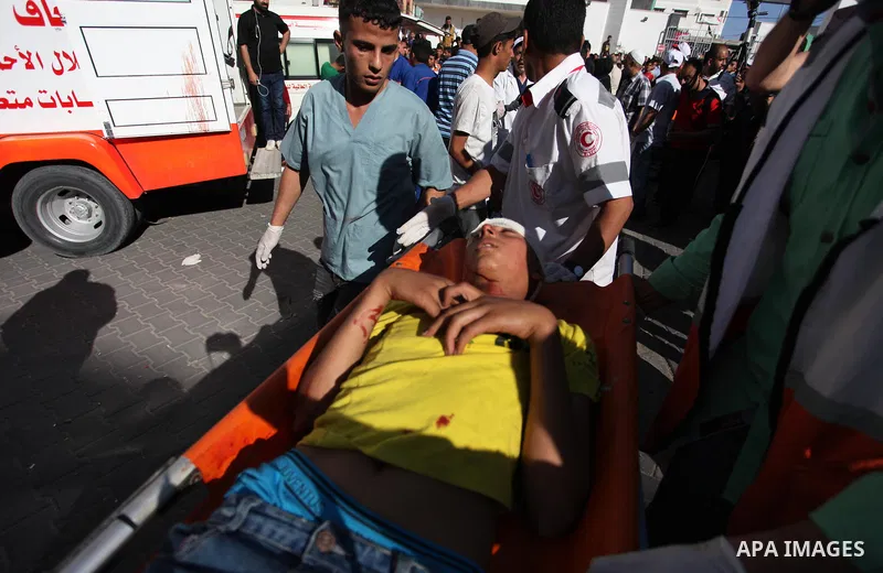 A Palestinian man who was wounded during clashes between Palestinian protesters and Israeli security forces at the Israel-Gaza border, in a tent city protest where Palestinians demand the right to return to their homelan...