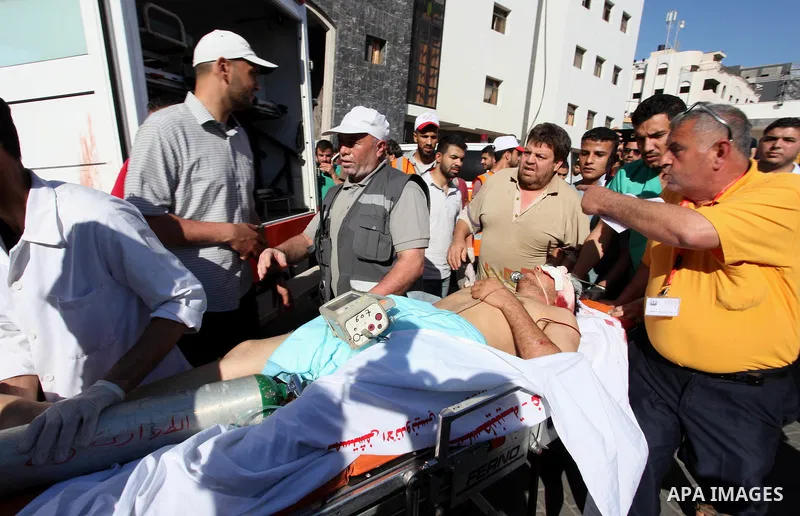 A Palestinian man who was wounded during clashes between Palestinian protesters and Israeli security forces at the Israel-Gaza border, in a tent city protest where Palestinians demand the right to return to their homelan...