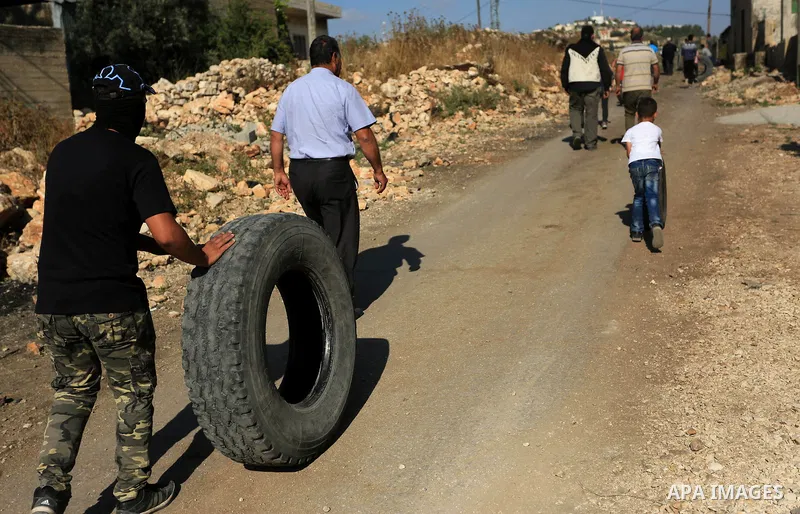 Palestinian protesters clash with Israeli secuirty forces against U.S. embassy move to Jerusalem and on the occasion of the 70th anniversary of the "Nakba", in the West Bank village of Kafr Qaddum, east of Qalqilia on Ma...
