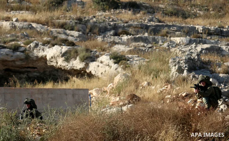 Israeli secuirty forces take position during clashes with Palestinian protesters against U.S. embassy move to Jerusalem and on the occasion of the 70th anniversary of the "Nakba", in the West Bank village of Kafr Qaddum,...