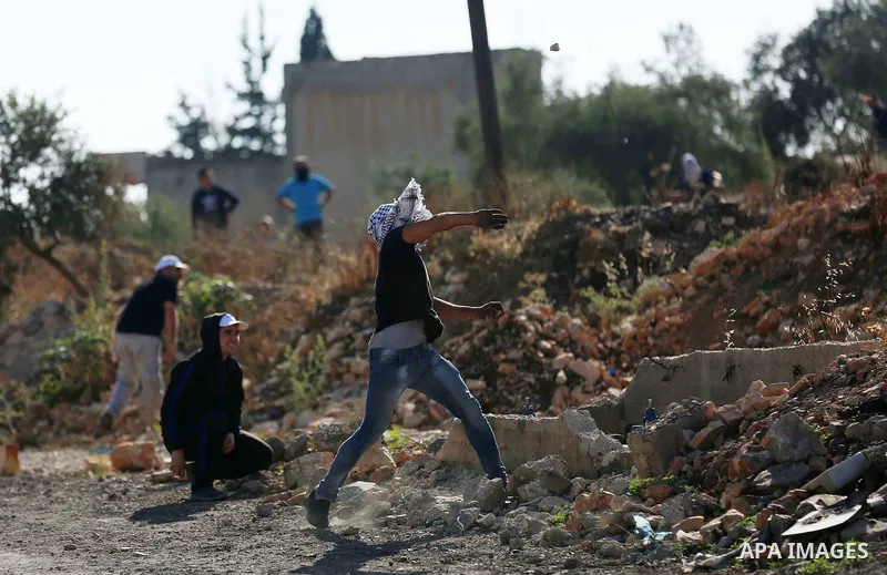 Palestinian protesters clash with Israeli secuirty forces against U.S. embassy move to Jerusalem and on the occasion of the 70th anniversary of the "Nakba", in the West Bank village of Kafr Qaddum, east of Qalqilia on Ma...
