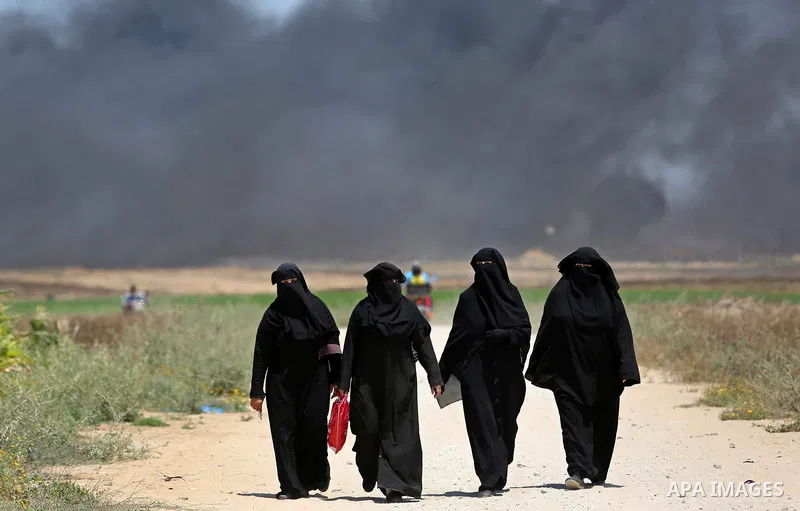Palestinian women gather during clashes with Israeli security froces in a tent city protest where Palestinians demand the right to return to their homeland, on the occasion of the 70th anniversary of the "Nakba", and aga...
