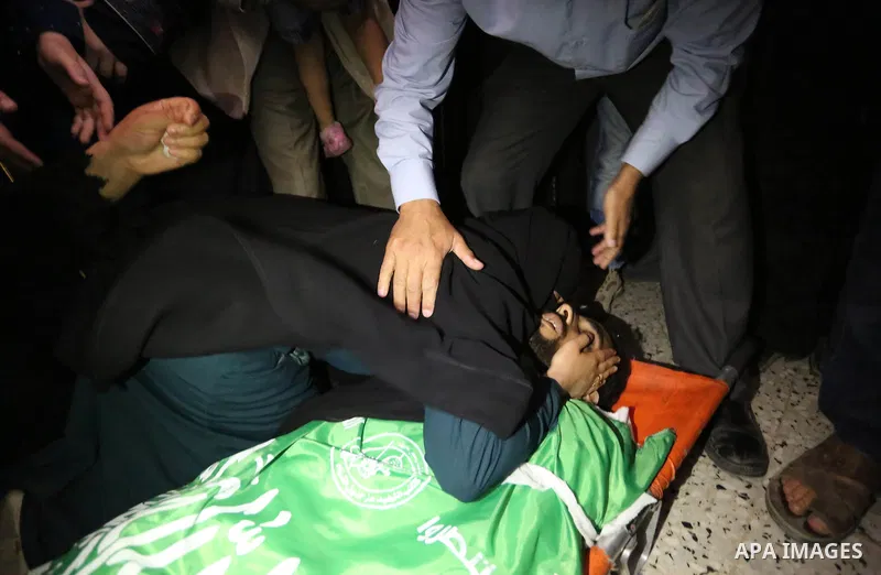 Relatives of Palestinian Mohammed Dwedar, 27, who was killed by Israeli troops during clashes in a tent city protest where Palestinians demand the right to return to their homeland, on the occasion of the 70th anniversar...
