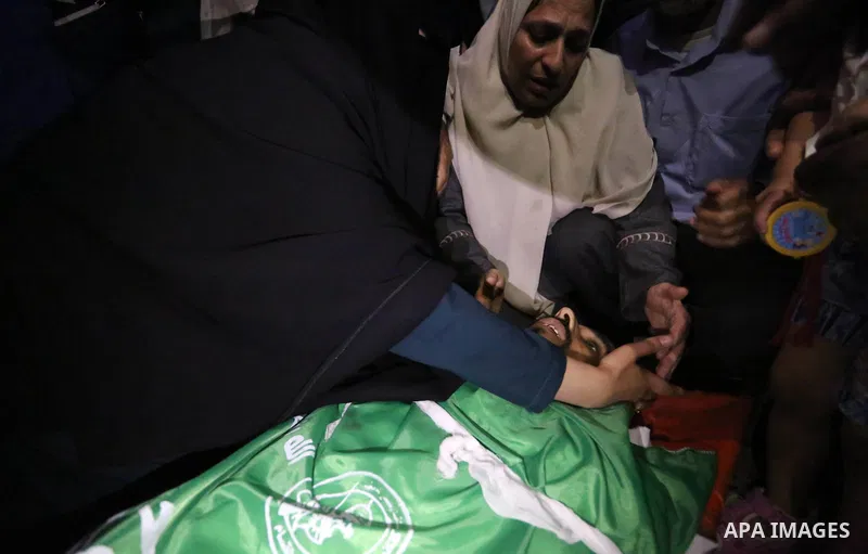 Relatives of Palestinian Mohammed Dwedar, 27, who was killed by Israeli troops during clashes in a tent city protest where Palestinians demand the right to return to their homeland, on the occasion of the 70th anniversar...