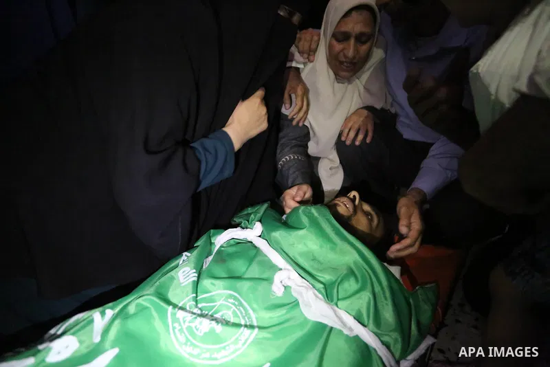 Relatives of Palestinian Mohammed Dwedar, 27, who was killed by Israeli troops during clashes in a tent city protest where Palestinians demand the right to return to their homeland, on the occasion of the 70th anniversar...