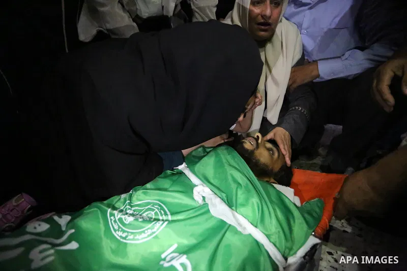 Relatives of Palestinian Mohammed Dwedar, 27, who was killed by Israeli troops during clashes in a tent city protest where Palestinians demand the right to return to their homeland, on the occasion of the 70th anniversar...