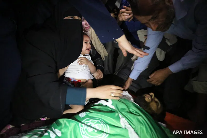 Relatives of Palestinian Mohammed Dwedar, 27, who was killed by Israeli troops during clashes in a tent city protest where Palestinians demand the right to return to their homeland, on the occasion of the 70th anniversar...
