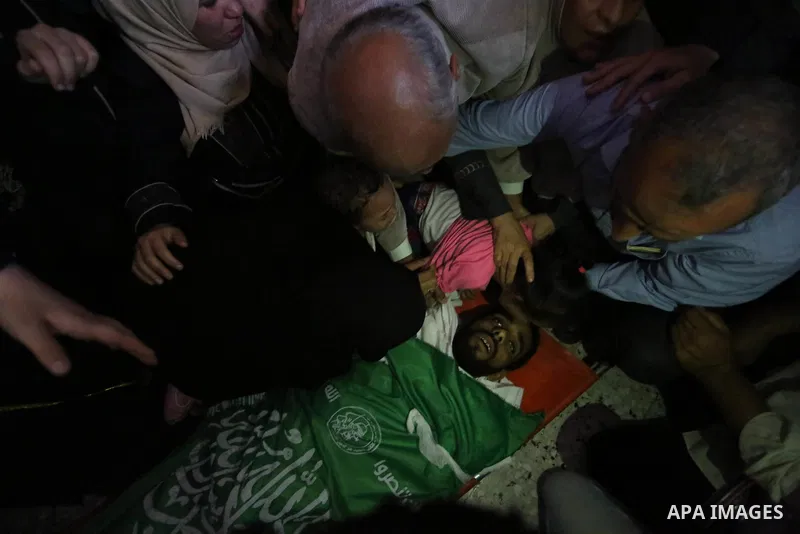 Relatives of Palestinian Mohammed Dwedar, 27, who was killed by Israeli troops during clashes in a tent city protest where Palestinians demand the right to return to their homeland, on the occasion of the 70th anniversar...