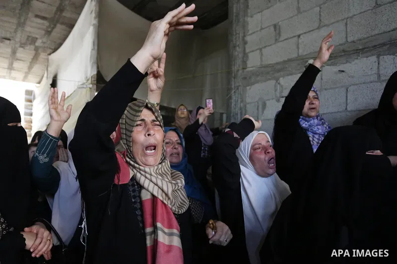 Relatives of Palestinian Nasser Ghorab, 51, who was killed the day before during clashes with Israeli troops along the border with Israel in a tent city protest where Palestinians demand the right to return to their home...
