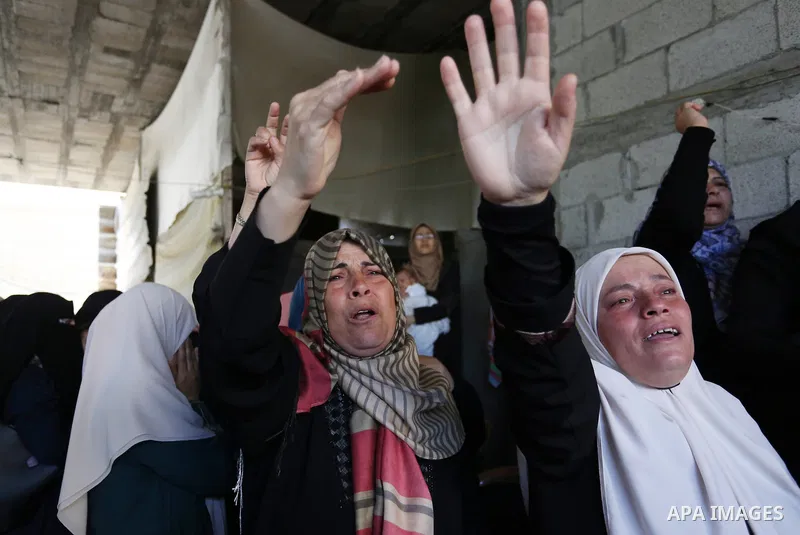 Relatives of Palestinian Nasser Ghorab, 51, who was killed the day before during clashes with Israeli troops along the border with Israel in a tent city protest where Palestinians demand the right to return to their home...