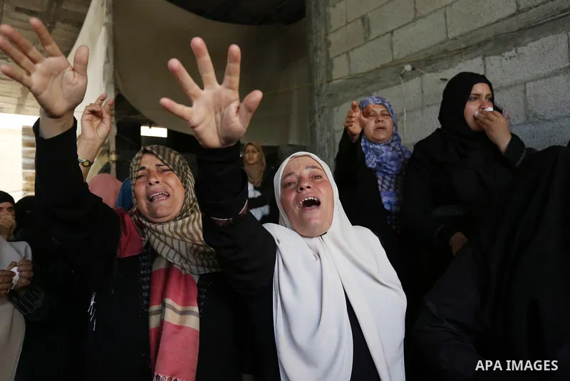 Relatives of Palestinian Nasser Ghorab, 51, who was killed the day before during clashes with Israeli troops along the border with Israel in a tent city protest where Palestinians demand the right to return to their home...