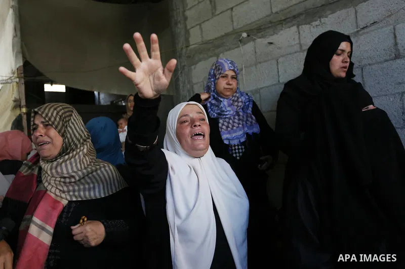 Relatives of Palestinian Nasser Ghorab, 51, who was killed the day before during clashes with Israeli troops along the border with Israel in a tent city protest where Palestinians demand the right to return to their home...