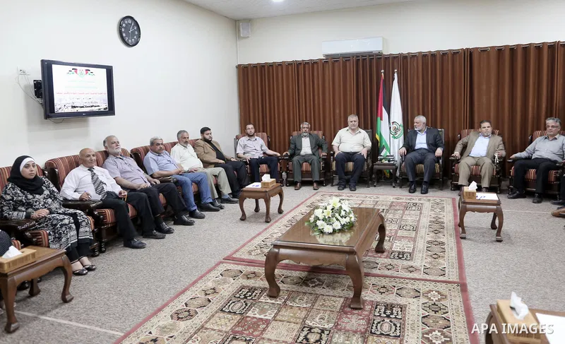 Chairman of the political bureau of the Hamas Palestinian Islamist movement, Ismail Haniyeh meets with supreme commission for the "Great Return March" and break the siege, at his office in Gaza city on May 19, 2018. Phot...
