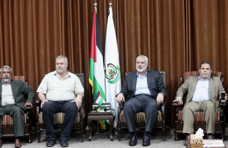 Chairman of the political bureau of the Hamas Palestinian Islamist movement, Ismail Haniyeh meets with supreme commission for the "Great Return March" and break the siege, at his office in Gaza city on May 19, 2018. Phot...