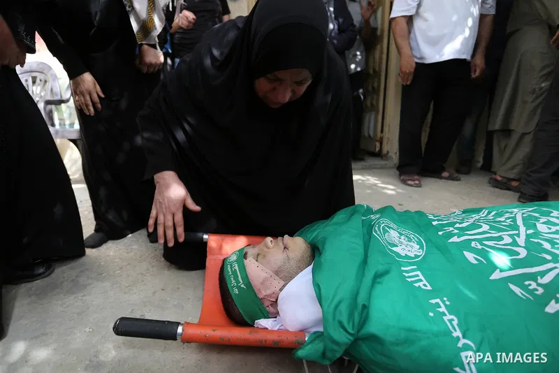 Relatives of Palestinian Mohammed Alian, 20, who died of wounds he sustained during clashes with Israeli troops in a tent city protest where Palestinians demand the right to return to their homeland and against U.S. emba...