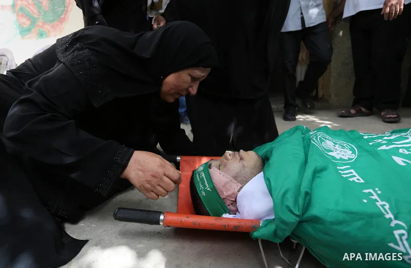 Relatives of Palestinian Mohammed Alian, 20, who died of wounds he sustained during clashes with Israeli troops in a tent city protest where Palestinians demand the right to return to their homeland and against U.S. emba...