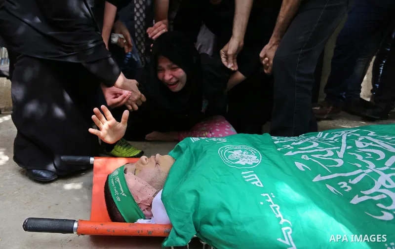 Relatives of Palestinian Mohammed Alian, 20, who died of wounds he sustained during clashes with Israeli troops in a tent city protest where Palestinians demand the right to return to their homeland and against U.S. emba...