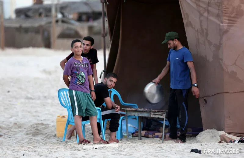 A Palestinian family gathers at the beach to break their fast during the Muslim Holy month of Ramadan, in Gaza City, on May 21, 2018. Ramadan is sacred to Muslims because it is during that month that tradition says the K...