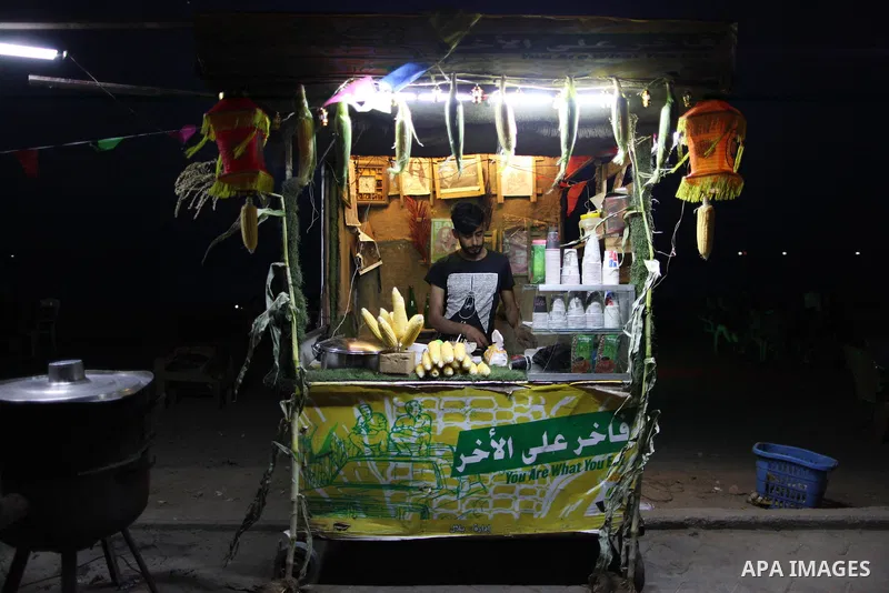 A Palestinian vendor sells corns on the Muslim holy fasting month of Ramadan in Gaza city on May 21, 2018. Ramadan is sacred to Muslims because it is during that month that tradition says the Koran was revealed to the Pr...