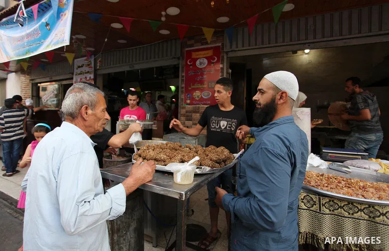 A Palestinian vendor prepares traditional chickpeas known as "Falafel" for breakfasting on the Muslim holy fasting month of Ramadan in Gaza city on May 21, 2018. Ramadan is sacred to Muslims because it is during that mon...