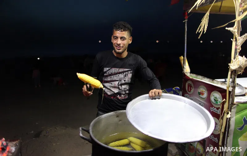 A Palestinian vendor sells corns on the Muslim holy fasting month of Ramadan in Gaza city on May 21, 2018. Ramadan is sacred to Muslims because it is during that month that tradition says the Koran was revealed to the Pr...