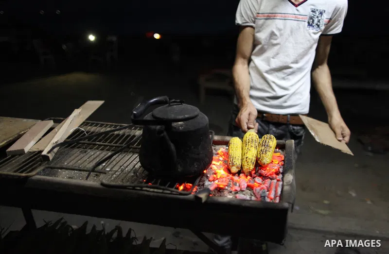 A Palestinian vendor sells corns on the Muslim holy fasting month of Ramadan in Gaza city on May 21, 2018. Ramadan is sacred to Muslims because it is during that month that tradition says the Koran was revealed to the Pr...