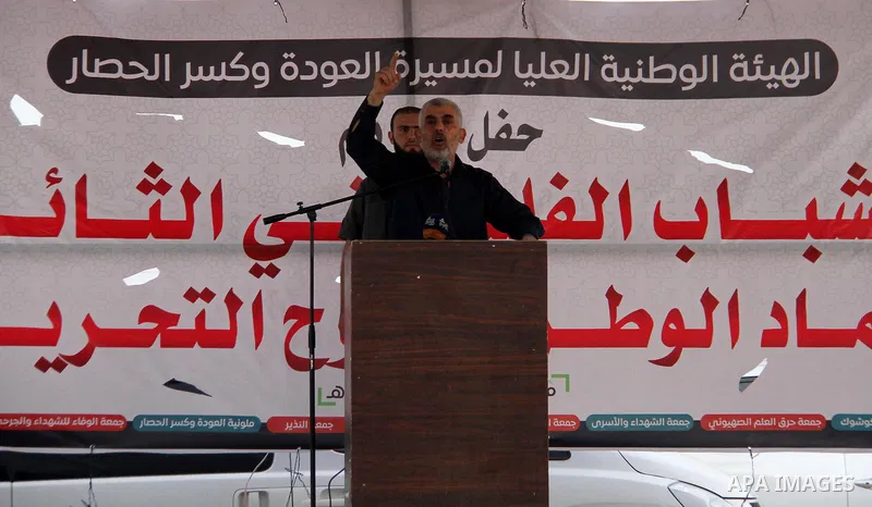 Hamas's leader in the Gaza Strip Yahya Sinwar speaks as he attends the breakfast meal at the Israel-Gaza border, in east of Gaza city, on May 23, 2018. Ramadan is sacred to Muslims because it is during that month that tr...