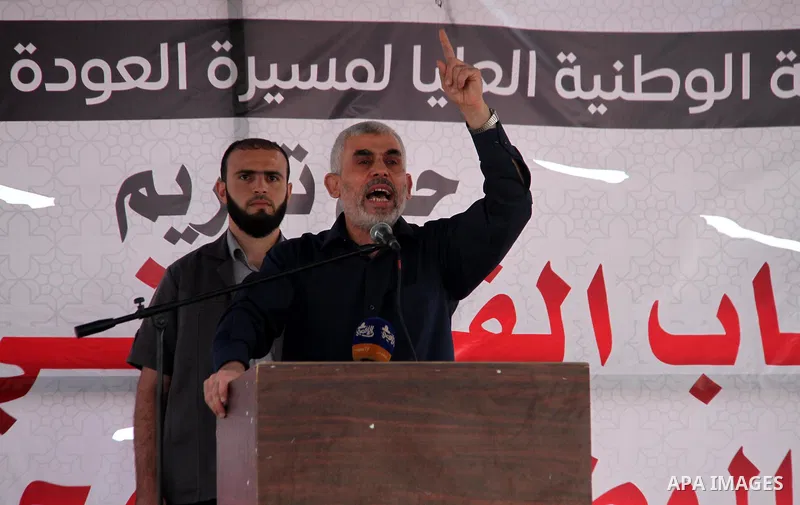 Hamas's leader in the Gaza Strip Yahya Sinwar speaks as he attends the breakfast meal at the Israel-Gaza border, in east of Gaza city, on May 23, 2018. Ramadan is sacred to Muslims because it is during that month that tr...