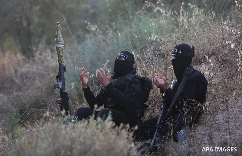 Palestinian militants pray at the border in the east of Gaza city on the Muslim holy fasting month of Ramadan on May 24, 2018. Ramadan is sacred to Muslims because it is during that month that tradition says the Koran wa...
