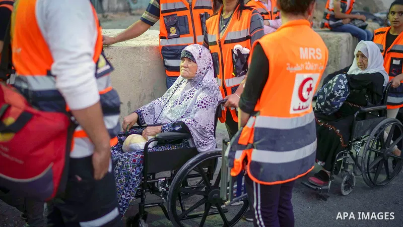 Palestinians make their way through Qalandia checkpoint to attend the second Friday prayer of the holy fasting month of Ramadan in Jerusalem's Al-Aqsa mosque, near Ramallah in the occupied West Bank, on May 25, 2018. Ram...